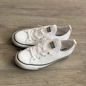 Slip on white converse.